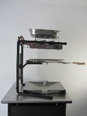 Foyer-gaz avec chassis grillade-raclette